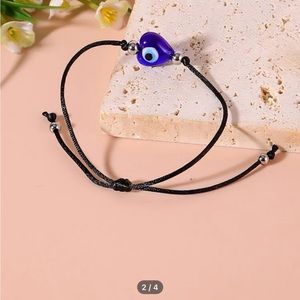 EVIL EYE STRING BRACELET